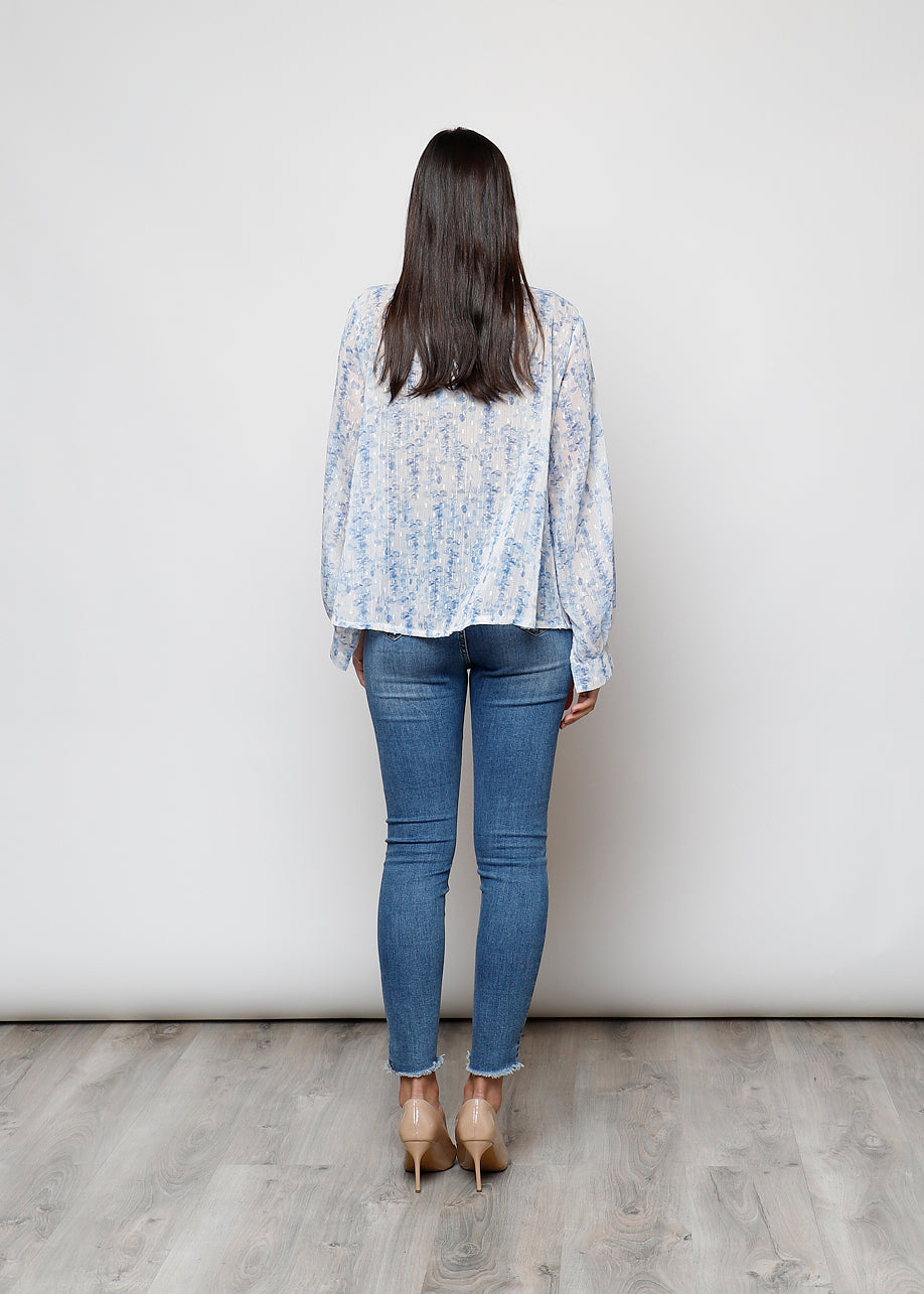 Camicia con fiocco, a manica lunga, stampa floreale con filo lurex.