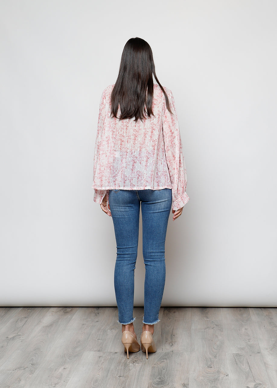 Camicia con fiocco, a manica lunga, stampa floreale con filo lurex.