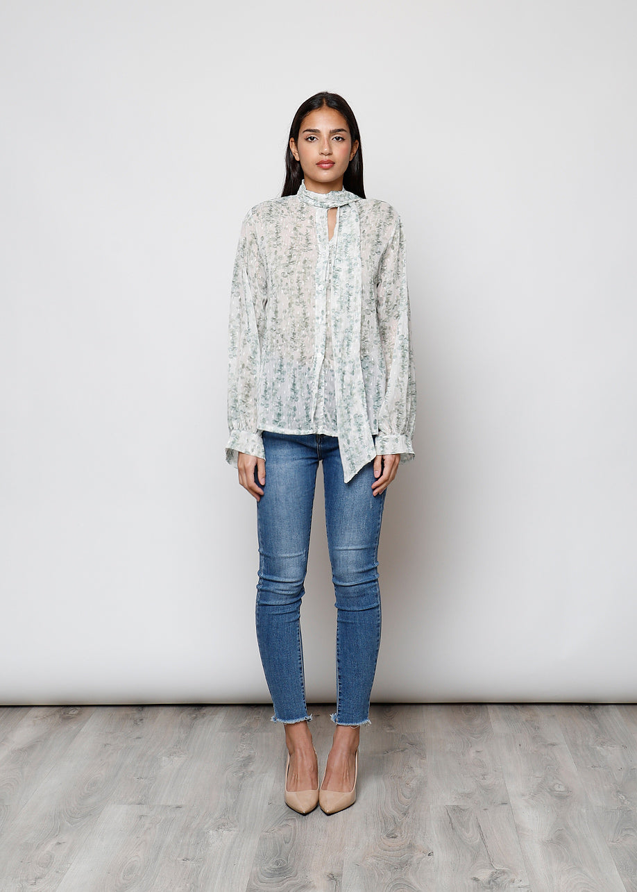 Camicia con fiocco, a manica lunga, stampa floreale con filo lurex.