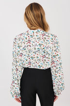 Camicia elegante da donna con maniche lunghe a sbuffo